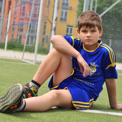 Kid in a football field
