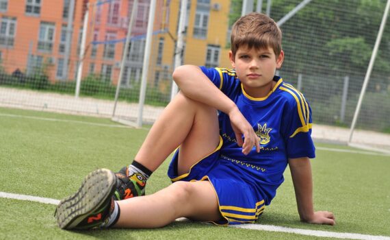 Kid in a football field