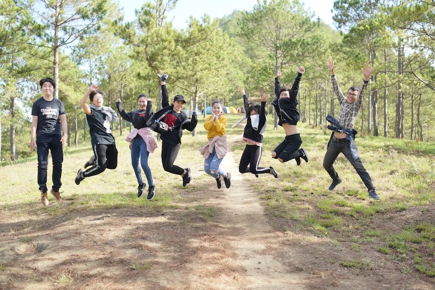 Kids from Staten Island School joyfully jumping in a park captured in our Staten Island School photography sessions.