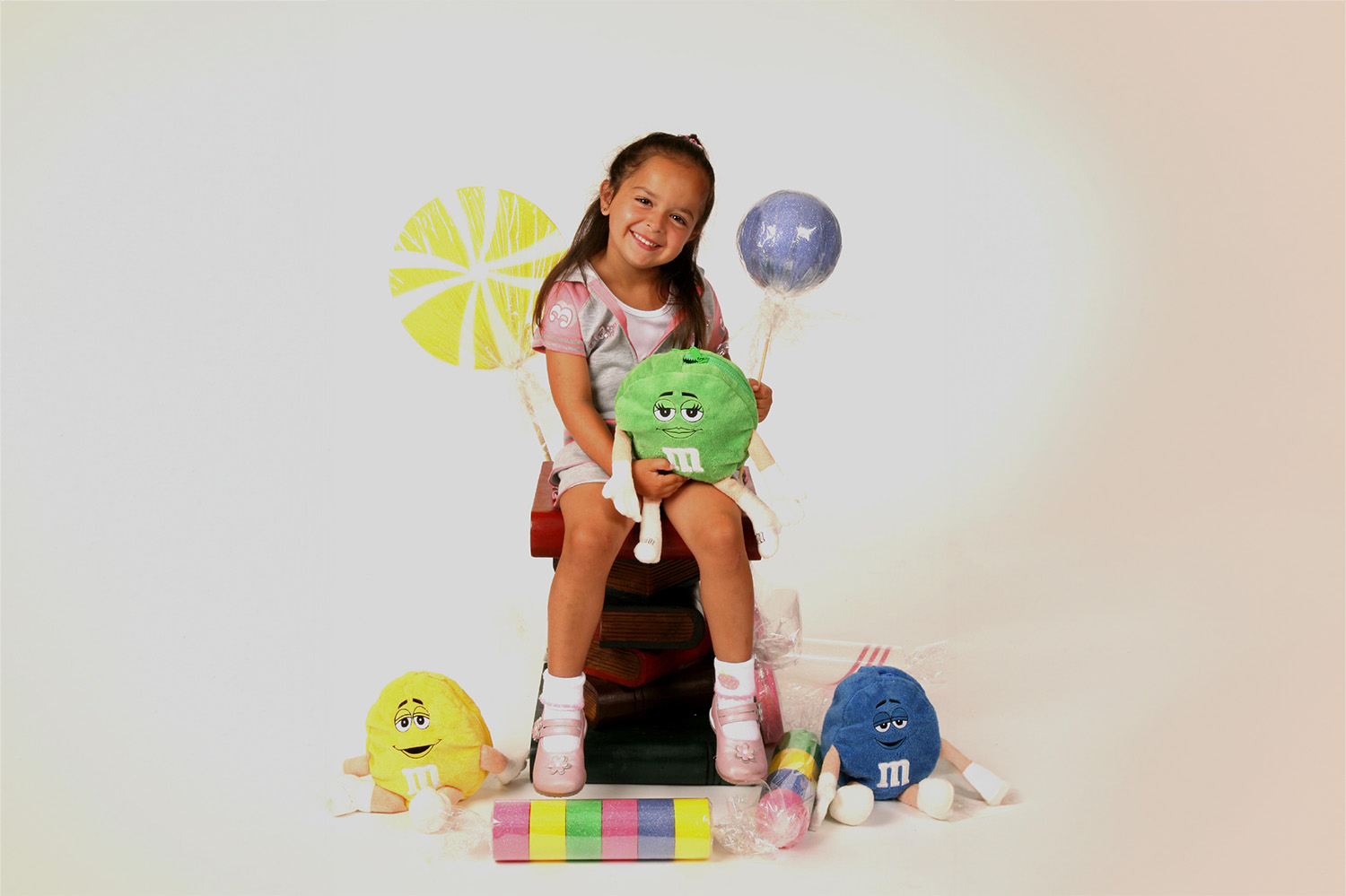 Brooklyn student smiling with stuffed animals on picture day by ABC School Photographers - School Photography Company in Brooklyn